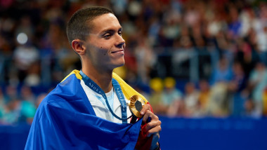 David Popovici of Romania celebrates his gold medal during the Men's 200m Freestyle Medal Ceremony on day three of the Olympic Games Paris 2024