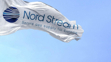 Greifswald, GER, September 2022: Flag with the Nord Stream logo waving to the fan on a clear day. Nord Stream is a gas pipeline that directly transpor