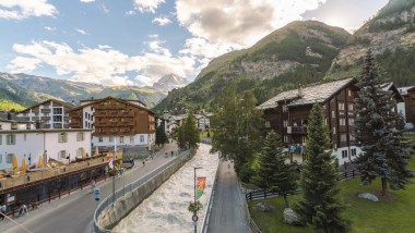 Switzerland, Valais, Town in mountain landscape