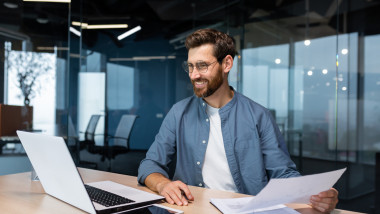 Mature,Businessman,In,Shirt,Doing,Paperwork,,Man,Working,With,Documents,