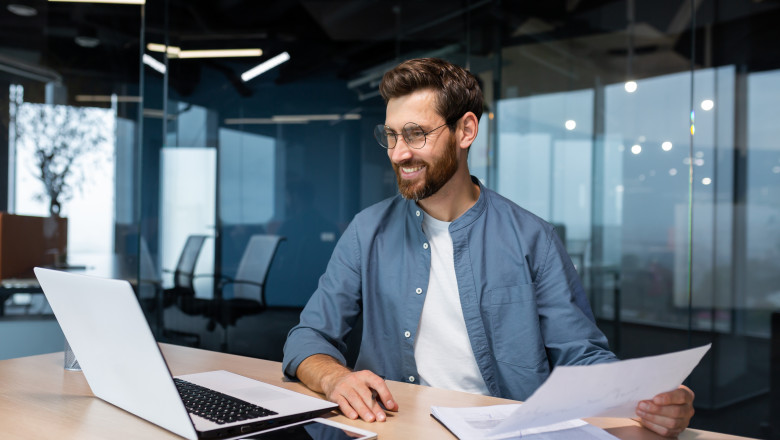 Mature,Businessman,In,Shirt,Doing,Paperwork,,Man,Working,With,Documents,