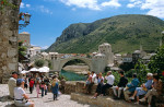 Stari Most, Old Bridge, following reconstruction, tourists and Neretva River, Mostar, Bosnia Herzegovina, Former Yugoslavia