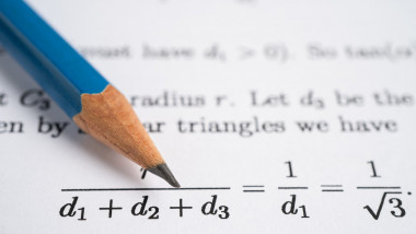 Pencil on mathematic formula exercise test paper in education sc