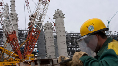 Workmen at work at the Sakenergy liquefied natural gas plant and oil export terminal at Prigorodnye, Sakhalin, Russia