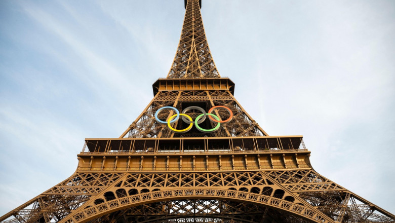 Paris, France. 13 August 2024. The Eiffel Tower, featuring large suspended Olympic Rings, prepares for the Paralympic Games. The Olympic Games closed on 11 August and the Paralympic Games begin on 28 August. Credit: Benjamin Wareing/Alamy Live News