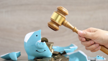 Financial,Problem,,Woman,Hand,Holding,Gavel,Wooden,And,Broken,Piggy