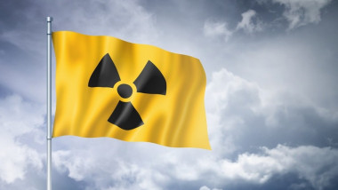 radioactive nuclear symbol flag on a cloudy sky