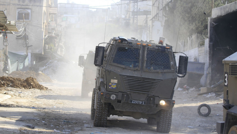 Israeli armoured vehicles drive on a destroyed street during a raid in Tulkarem, Tulkarem, West Bank, Palestinian Territory - 10 Sep 2024