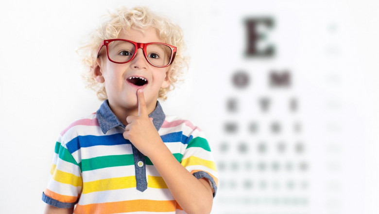 Child at eye sight test. Little kid selecting glasses at optician store. Eyesight measurement for school kids. Eye wear for children. Doctor performin