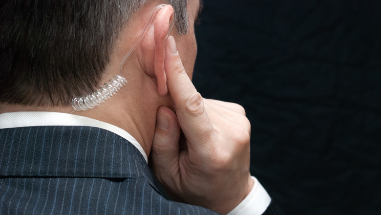 Secret Service Agent Listens To Earpiece, Shoulder