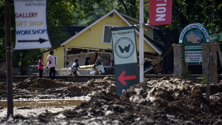 People view damage in the aftermath of Hurricane Helene on September 29, 2024 in Old Fort, North Carolina