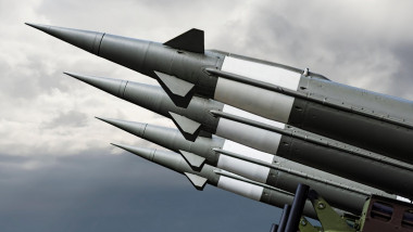 Nuclear Missiles With Warhead Aimed at Gloomy Sky. Balistic Rockets War Background.