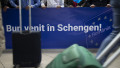 A banner reading "Welcome to Schengen" is displayed at the arrivals section of Henri Coanda International Airport