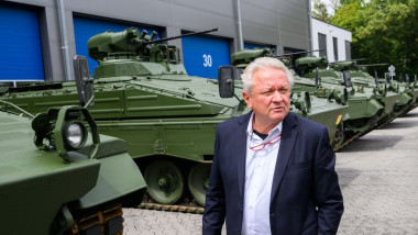 14 July 2022, Lower Saxony, Unterl: Armin Papperger, Rheinmetall Executive Board member, stands in front of reconditioned Marder infantry fighting vehicles during a tour of Rheinmetall's Unterluess plant on the occasion of the summer trip of Lower Saxony'