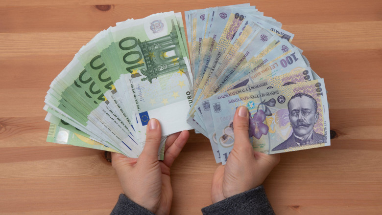 Girl hands counting Romanian LEI currency and Euro banknotes, close up