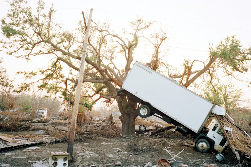 Truck hanging in tree, aftermath of Hurricane Katrina, Plaquemines Parish, Louisiana, USA