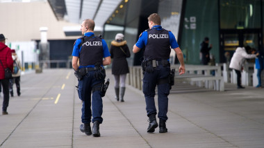 Two,Policemen,On,Patrol,At,Observation,Deck,Of,Zürich,Airport