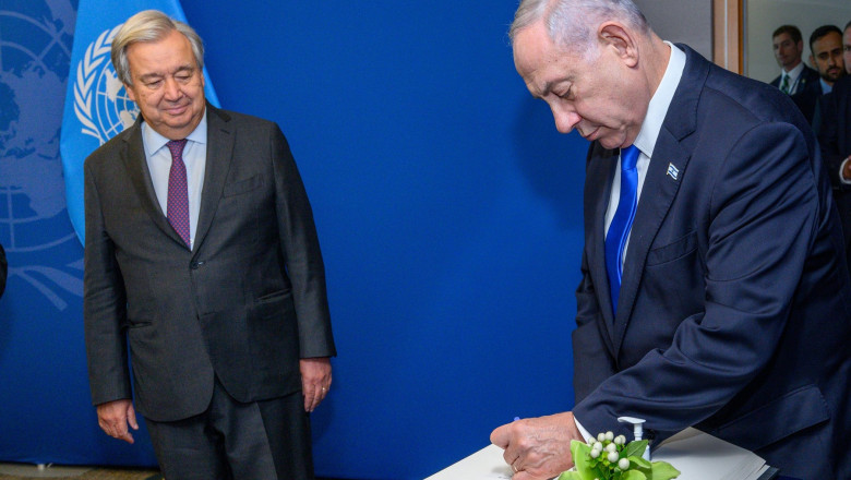 New York, USA. 20th Sep, 2023. United Nations Secretary-General Antnio Guterres watches as Israeli Prime Minister Benjamin Netanyahu signs a ceremonial book during the 78th UN General Assembly at the UN headquarters. Credit: Enrique Shore/Alamy Live News