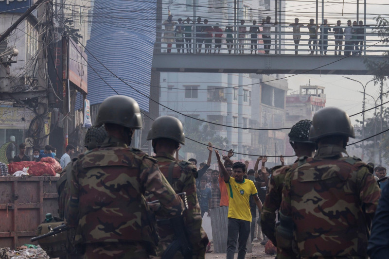 Bangladeshi soldiers take a position at Mohammadpur area during a national curfew in Dhaka. The Bangladesh government imposed a nationwide curfew on July 20, 2024, due to escalating violence and protests. Internet, mobile data, and public transport are di