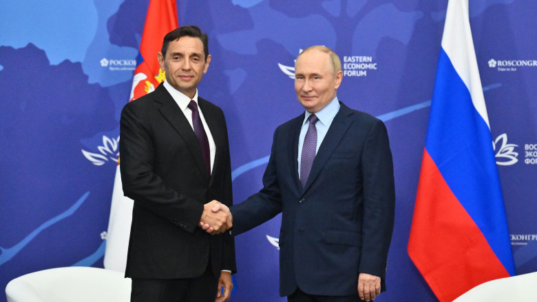 Vladimir Putin shake hands with Serbian Deputy Prime Minister Aleksandar Vulin on the sidelines of the Eastern Economic Forum in Vladivostok on September 4, 2024