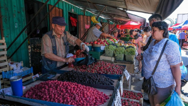 Karaganda, Kazakhstan - August 18, 2023: A strawberry and blackberry vendor at the New Bazaar in Karaganda, Kazakhstan.