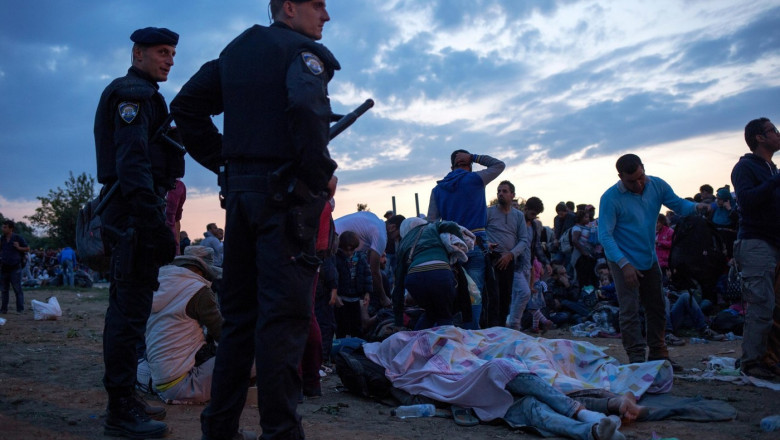 Bapska border crossing between Serbia and Croatia. 23rd September, 2015. Croatian police look on as a surge of refugees arrived at the border town of Bapska by the Serbian border. Credit: Rey T. Byhre/Alamy Live News