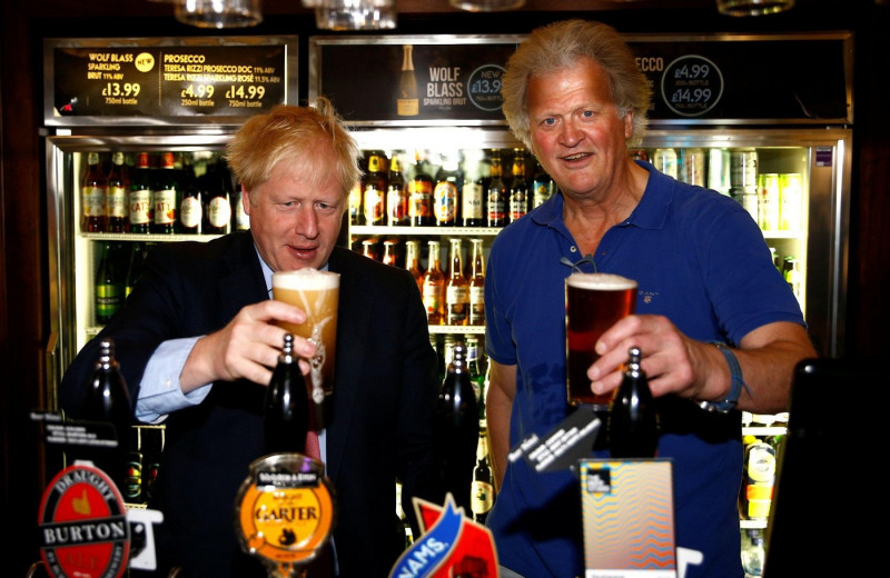 File photo dated 10/07/19 (then)Conservative Party leadership candidate Boris Johnson during a visit to Wetherspoons Metropolitan Bar in London with Tim Martin, Chairman of JD Wetherspoon. Mr Martin has criticised "slightly daft" proposals from academics