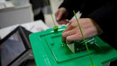 A voter casts her vote at a polling station during the elections in tbilisi, georgia