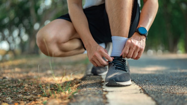 Close,Up,-,Running,Shoes,Runner,Man,Tying,Laces,For