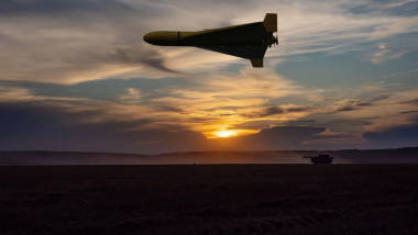 A Russian military drone flying over a peaceful field, evening lighting.