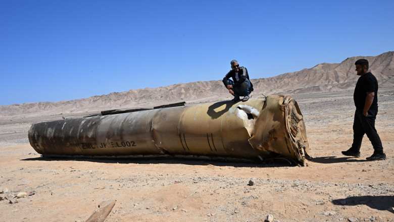 People Look At An Iranian Missile In The Negev Desert