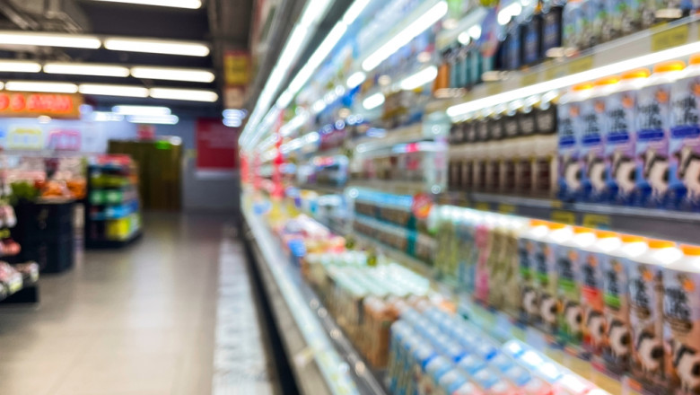 Blurred,Supermarket,Aisle,With,Colorful,Shelves,Of,Merchandise.,Perspective,View