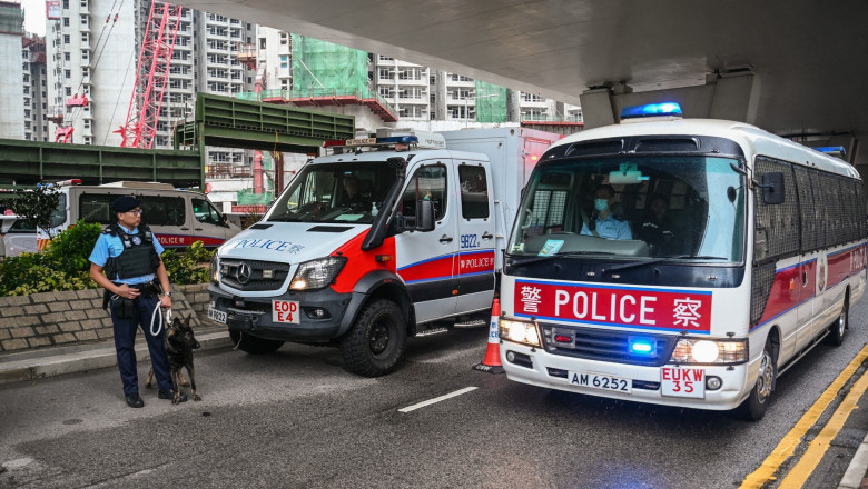 Police keep watch outside the West Kowloon Magistrates' Court in Hong Kong on November 19, 2024