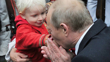 Vladimir Putin with a child