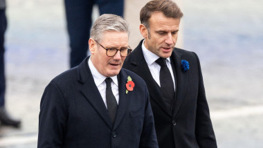 Paris, France. 11th Nov, 2024. Britain's Prime Minister Keir Starmer and France's President Emmanuel Macron stand at attention as the French Republican Guard cavalry (Garde Republicaine) parades on the Place de l'Etoile, during commemorations marking the