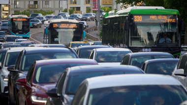 Bucharest, Romania - May 24, 2024: Cars in traffic at rush hour on a boulevard in Bucharest.