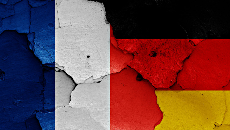 Flags,Of,France,And,Germany,Painted,On,Cracked,Wall