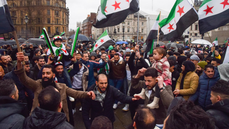 Syrians celebrate the toppling of Bashar al Assad regime in Trafalgar Square