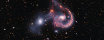 Spectacular image of galaxies colliding forms watchful eyes