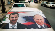 Poster cu Vladimir Putin si Bashar al Assad pe o masina din Damasc