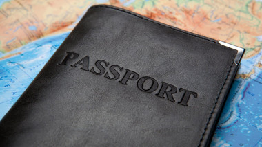 passport in the bag on a map