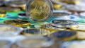 Close-up of euro banknotes and coins