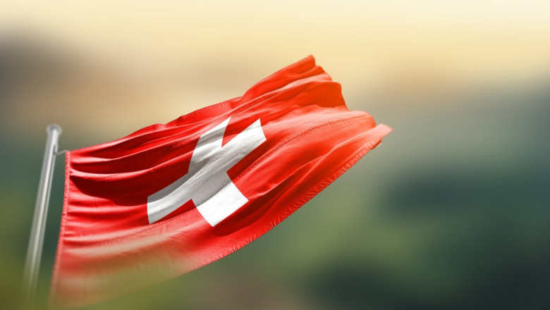 Switzerland,Flag,Waving,With,Beautiful,Background.,The,Flag,Blowing,With