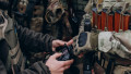 Ukrainian soldiers coordinating a drone during battle