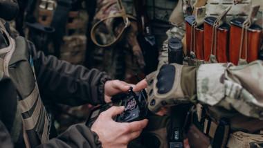 Ukrainian soldiers coordinating a drone during battle