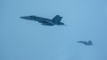 Finnish Air Force F/A-18 Hornets fly off the wing of a U.S. Air Force B-52H Stratofortress assigned to the 20th Expeditionary Bomb Squadron during a Bomber Task Force 25-1 mission over Europe, Nov. 25, 2024. By participating in exercises together, NATO Al