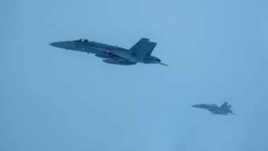 Finnish Air Force F/A-18 Hornets fly off the wing of a U.S. Air Force B-52H Stratofortress assigned to the 20th Expeditionary Bomb Squadron during a Bomber Task Force 25-1 mission over Europe, Nov. 25, 2024. By participating in exercises together, NATO Al