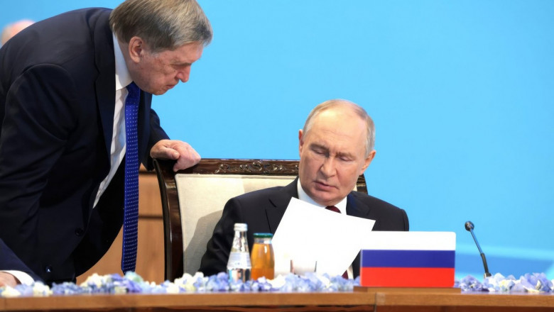 Astana, Kazakhstan. 28th Nov, 2024. Russian President Vladimir Putin, right, speaks with Presidential Aide Yury Ushakov, left, during the expanded Collective Security Council meeting of the Collective Security Treaty Organisation Summit, November 28, 2024