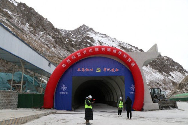 HEJING, CHINA - DECEMBER 30: Workers are seen at the construction site of the Tianshan Shengli Tunnel, the world s longe