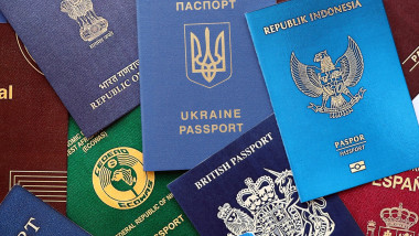 Many various passports of citizens of different countries and regions of the world